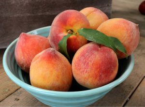 Georgia long has been associated with peaches, although peaches don't even rank in the top 10, in terms of food crops in Georgia.